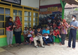 Children gather outside the shelter in Depok in West Java. The building offers a place of refuge [Jessica Washington/Al Jazeera]