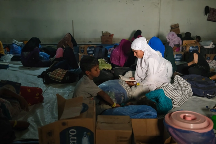 'We are helpless. Our land and home were taken from us. We came here to seek peace as we have experienced nothing but pain all our lives,' Romakto, a mother of three, said. 'When students attacked us, I was scared they might kill my children.' [Jessica Washington /Al Jazeera]