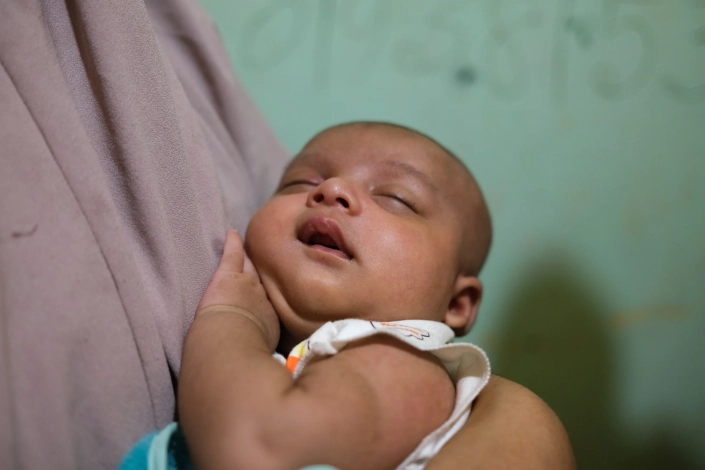 Formin gave birth to Mohammad in a hospital in Aceh. “People in this country have taken great care of me,” she said. [Jessica Washington/Al Jazeera]