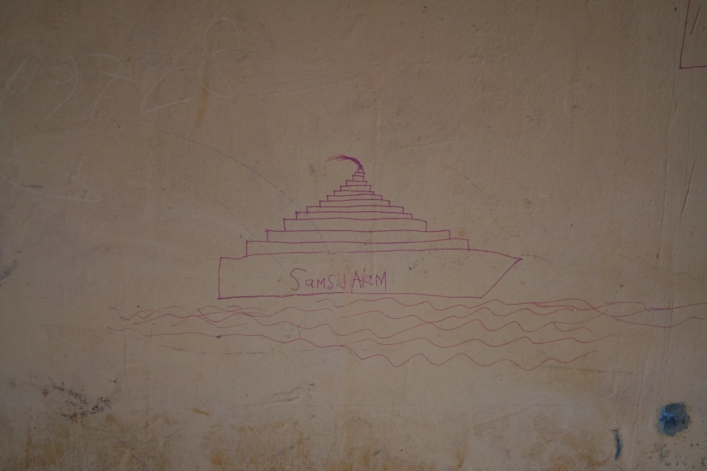 Dr Arika said they are also trying to work on 'trauma healing' with the refugees. On some of the walls at the shelter, a five-year-old Rohingya boy has drawn pictures of a boat at sea. [Jessica Washington/Al Jazeera]