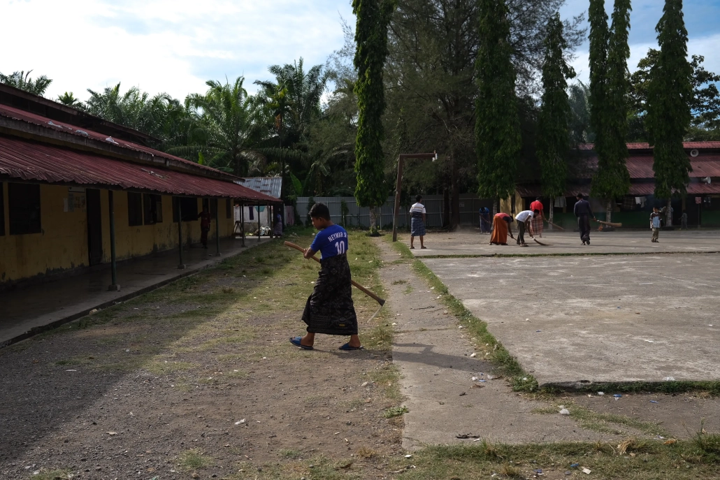 Activities like cleaning the compound provide a good way to pass the time. There are rosters pasted on the walls to indicate who is responsible for particular chores. [Jessica Washington/Al Jazeera]